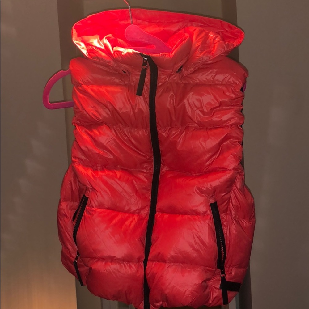 Burnt Red puffer vest by Calvin Klein